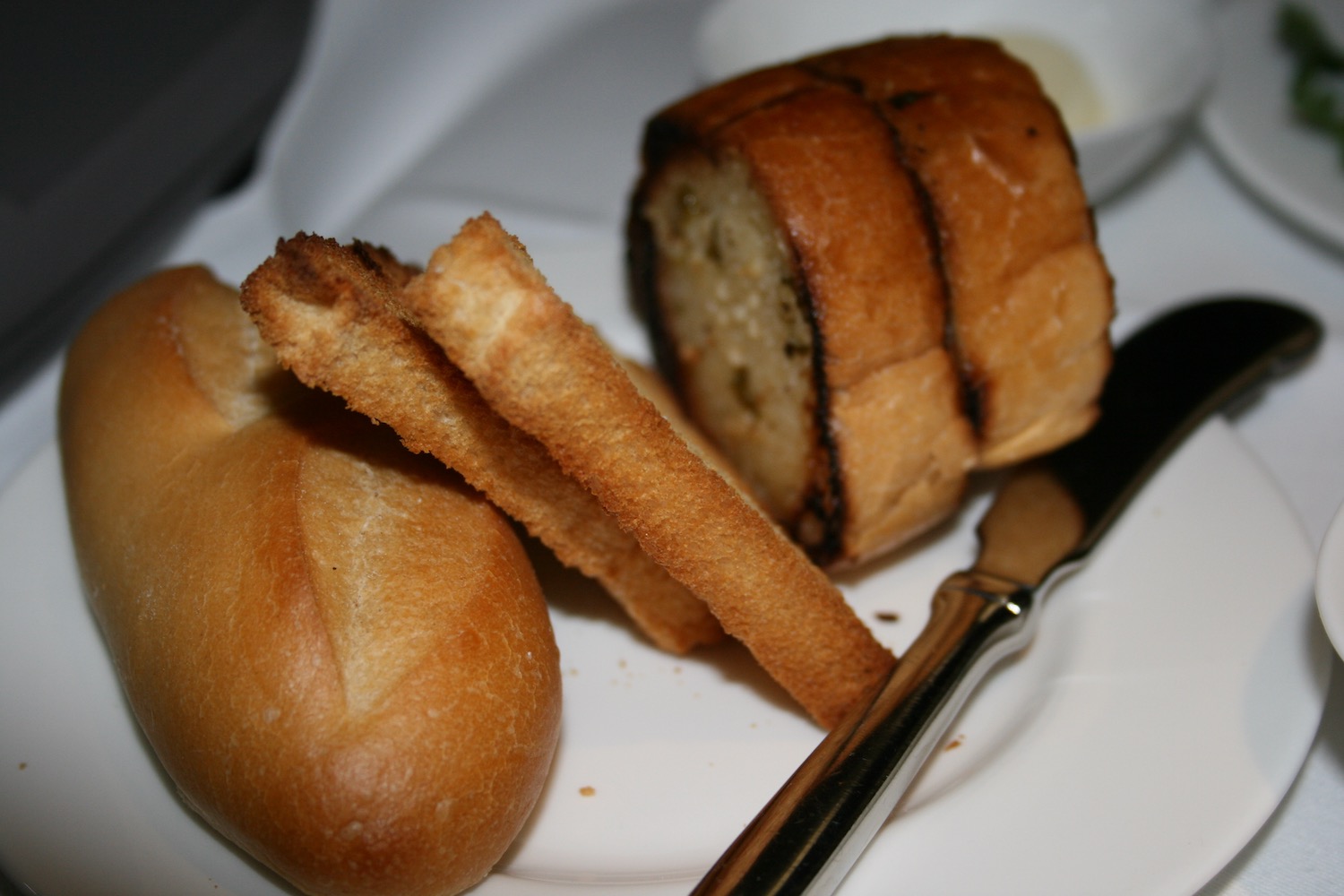 a plate of bread and a knife