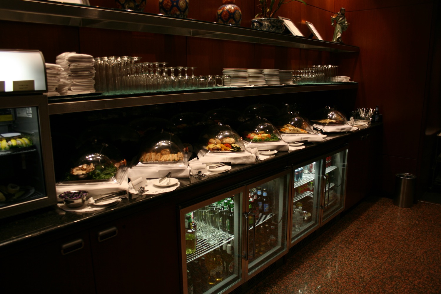 a buffet with plates and glasses