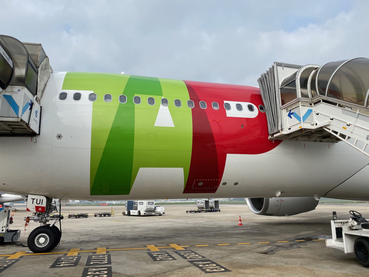 a large airplane with a green and red stripe