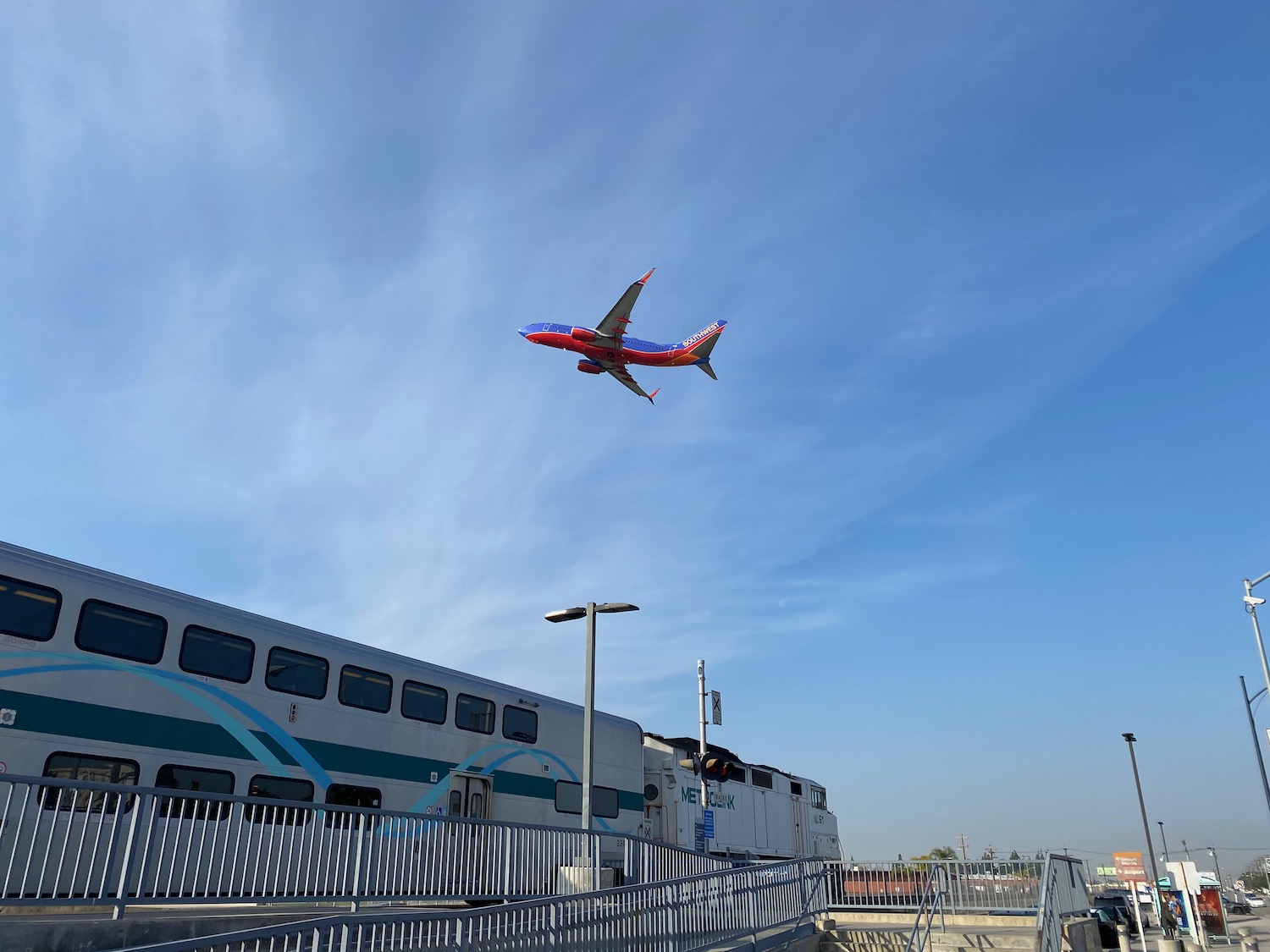 a plane flying over a train