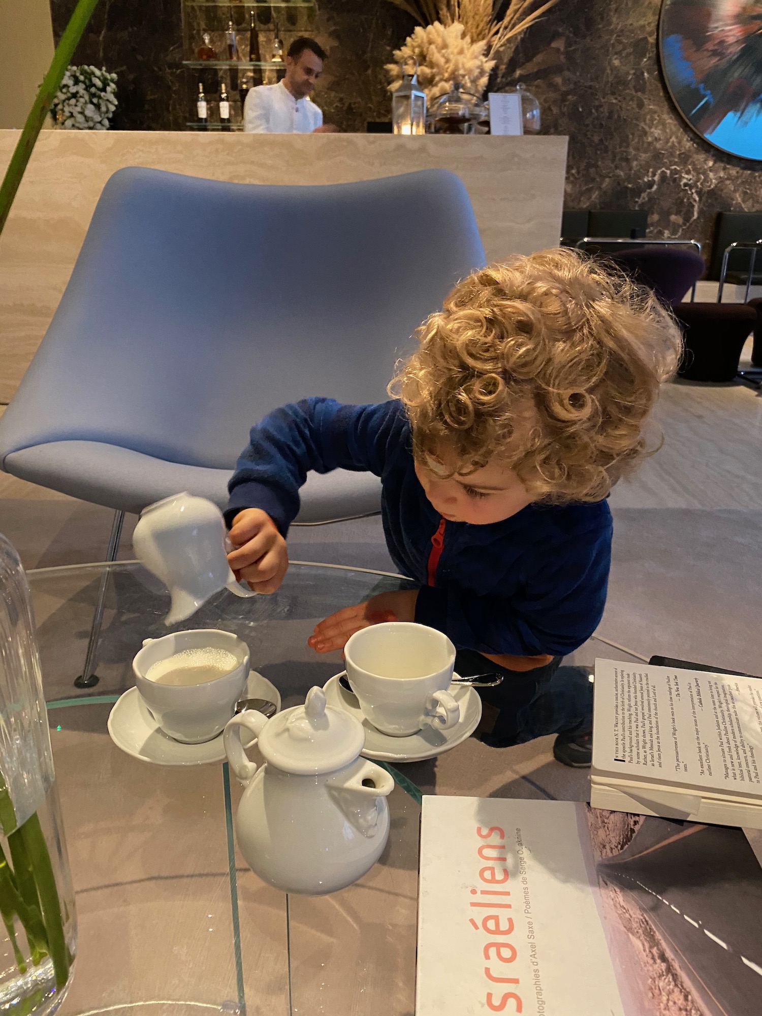 a child playing with tea set