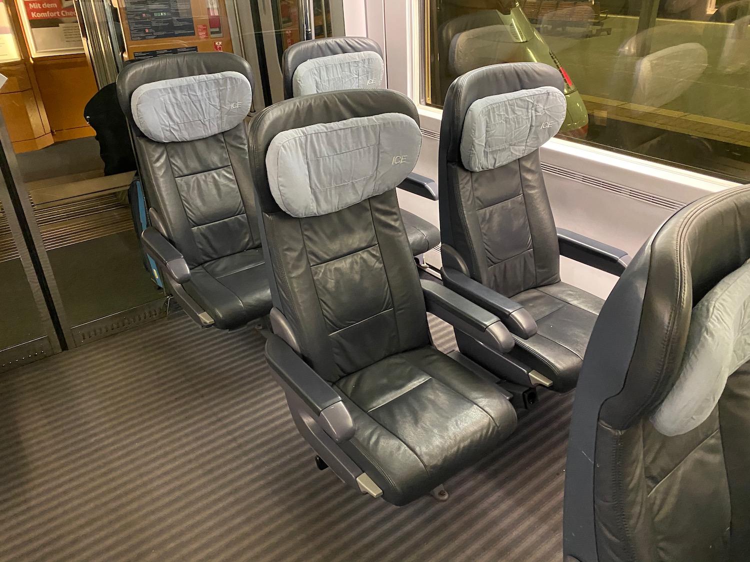 a group of black chairs in a train