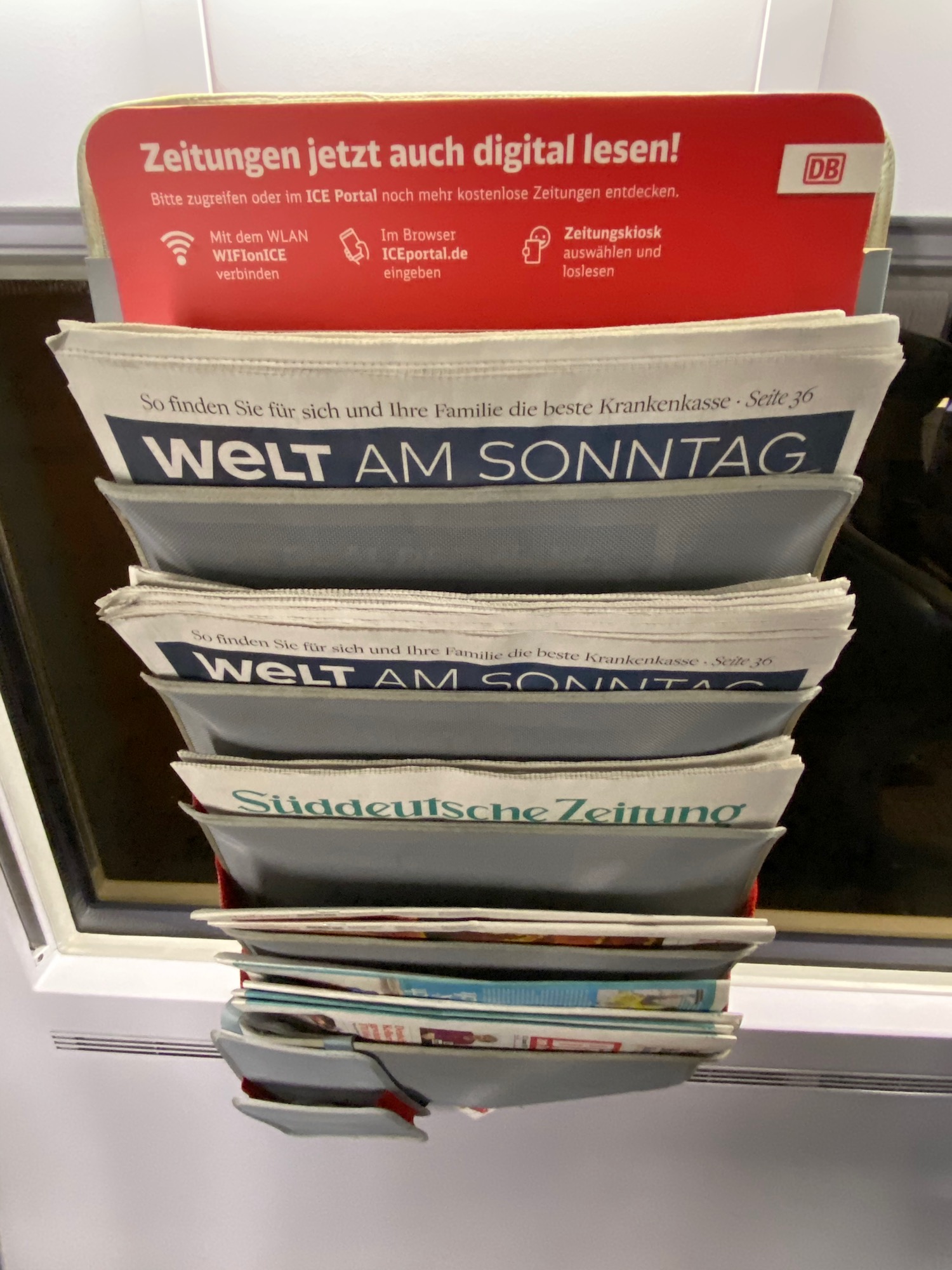a stack of newspapers in a rack