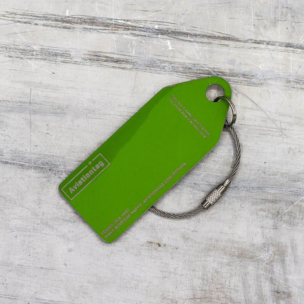 a green tag with a cord