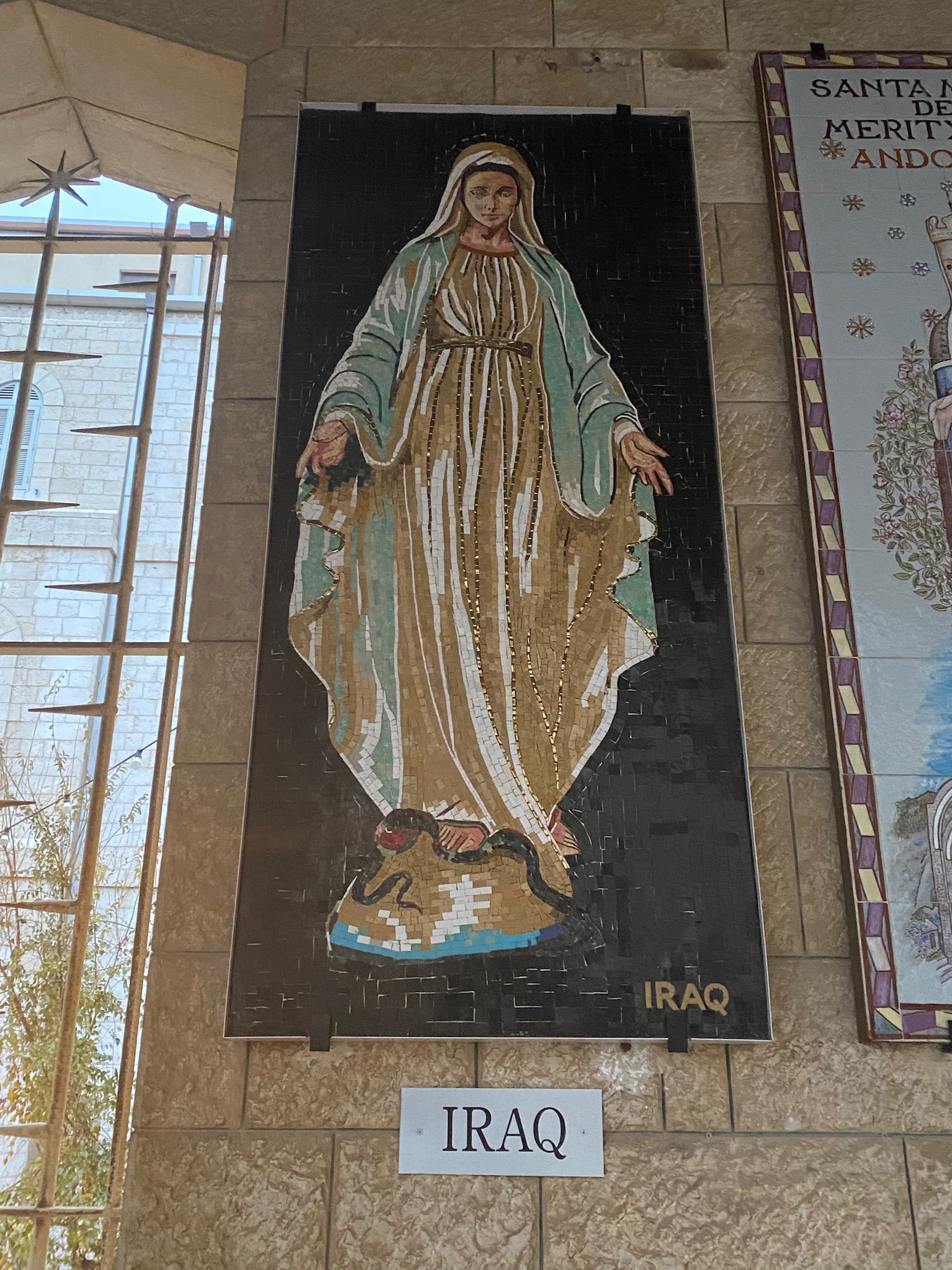 a mosaic of a woman in a robe