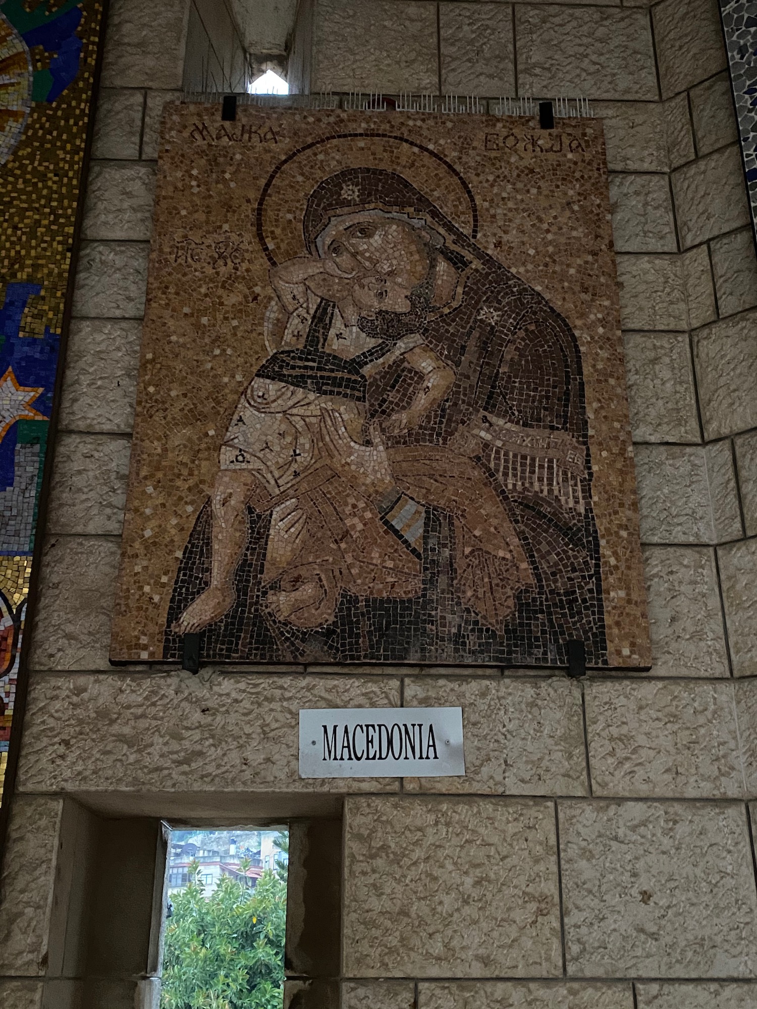 a mosaic of a mother and child on a wall