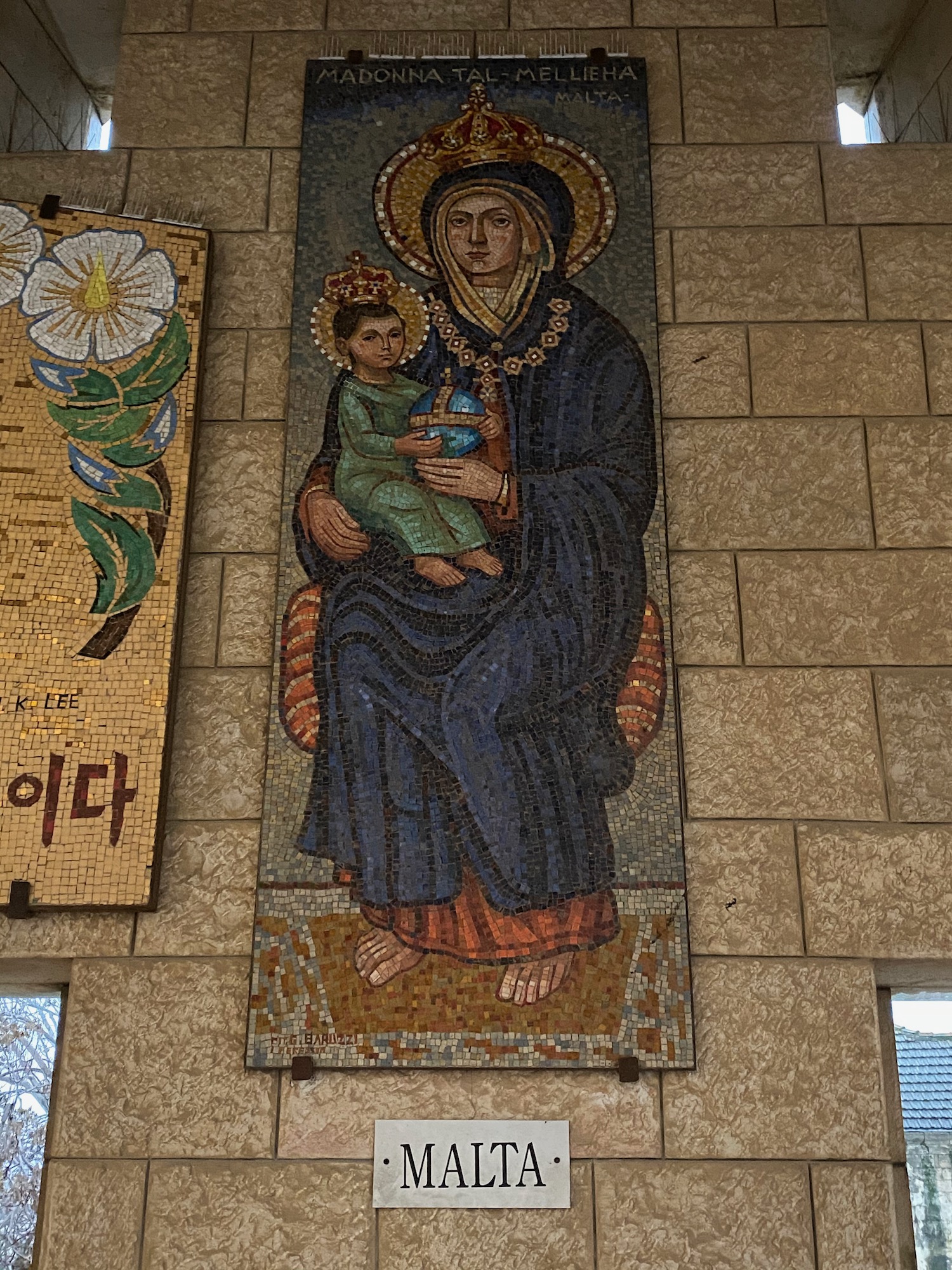 a mosaic of a woman holding a child
