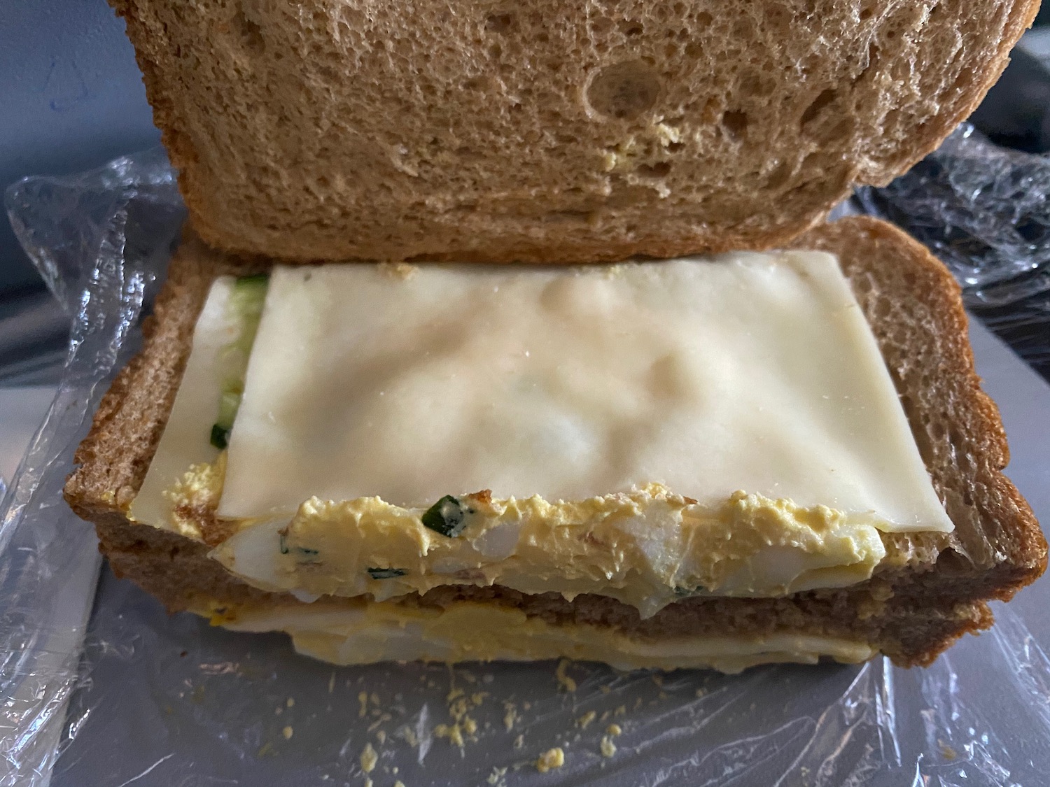 a sandwich with egg and cheese inside