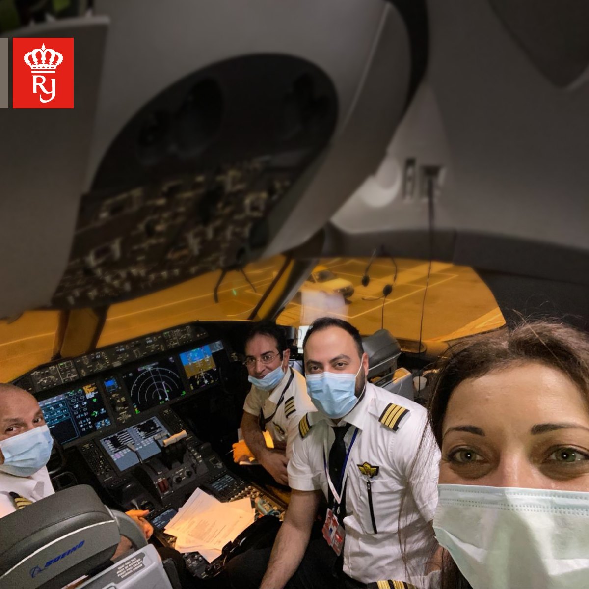 a group of people wearing face masks in a cockpit