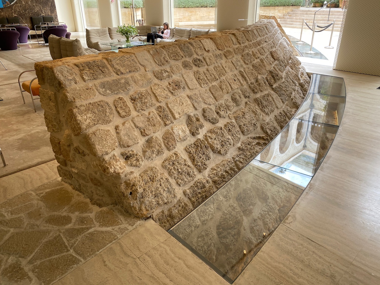 a stone wall in a room