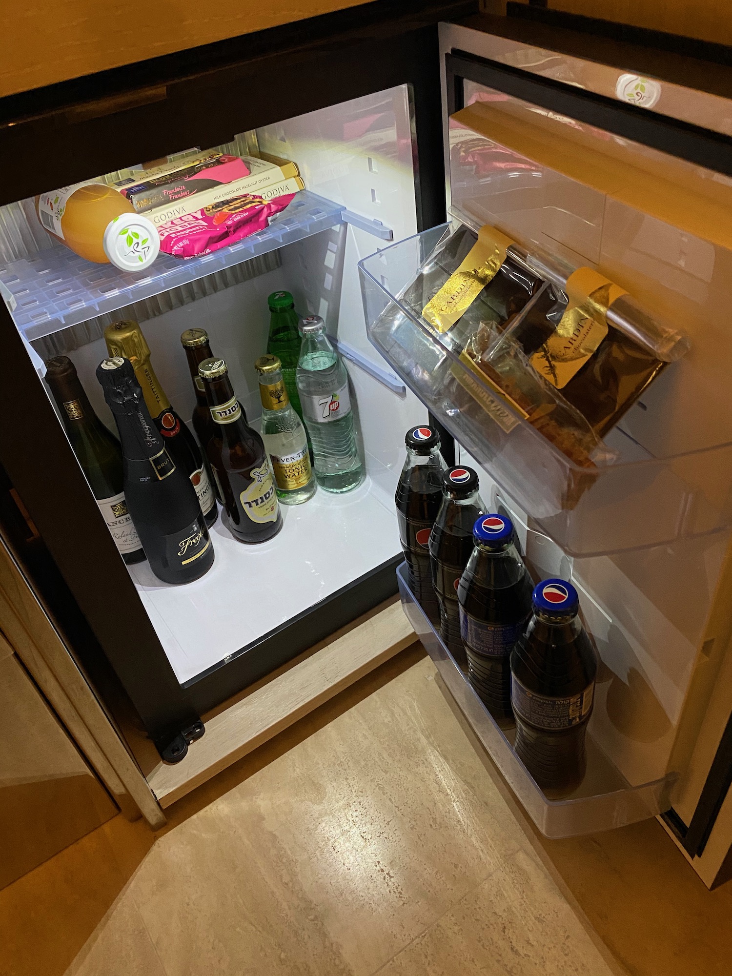 a refrigerator full of drinks and snacks
