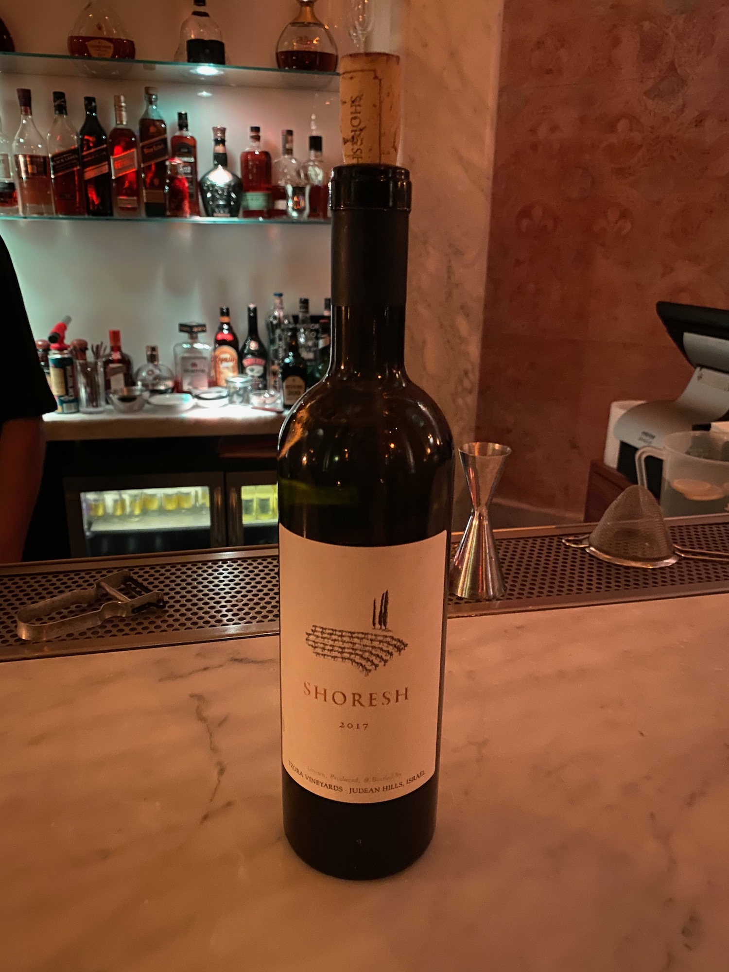 a bottle of wine on a counter