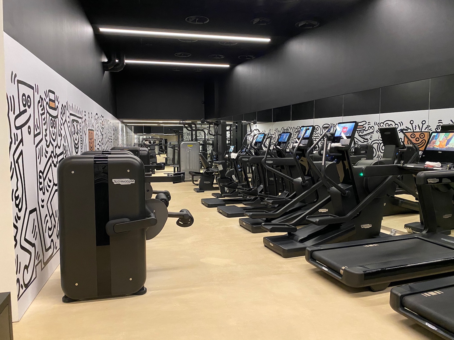 a room with treadmills and machines