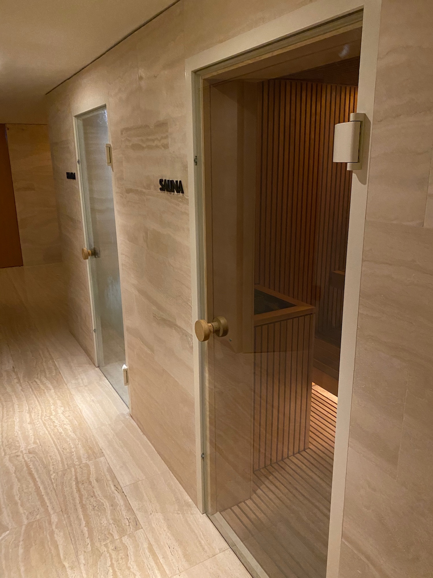 a room with a door and a sauna