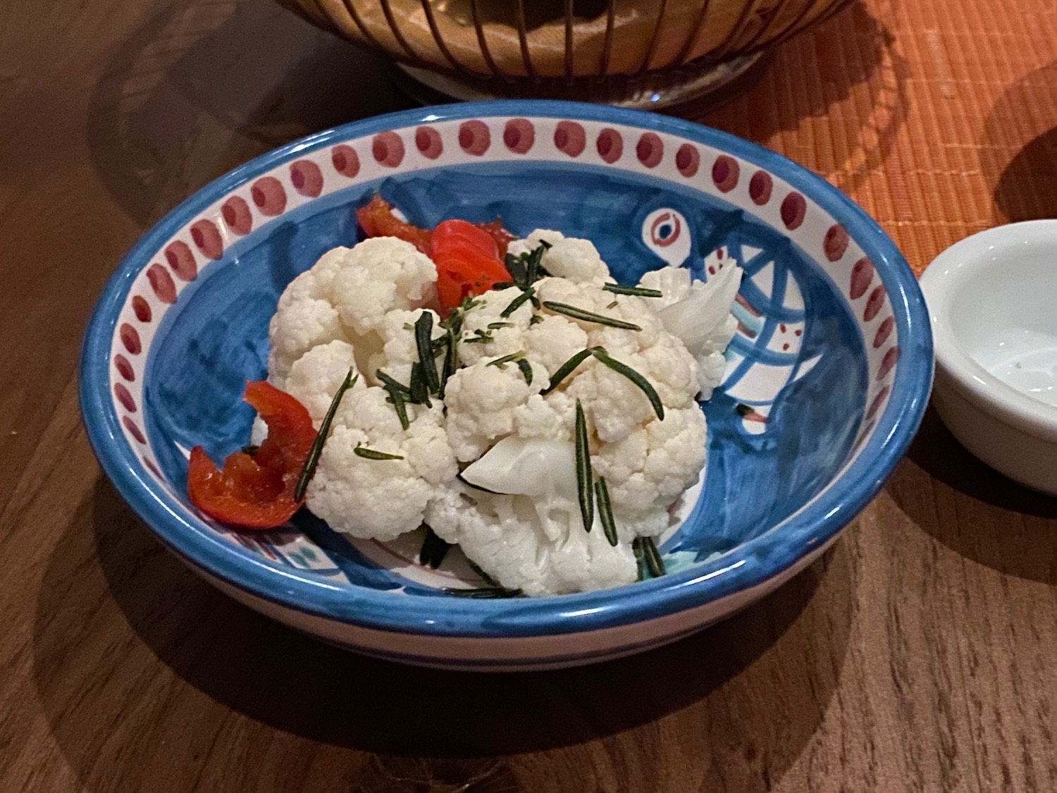a bowl of cauliflower and tomatoes