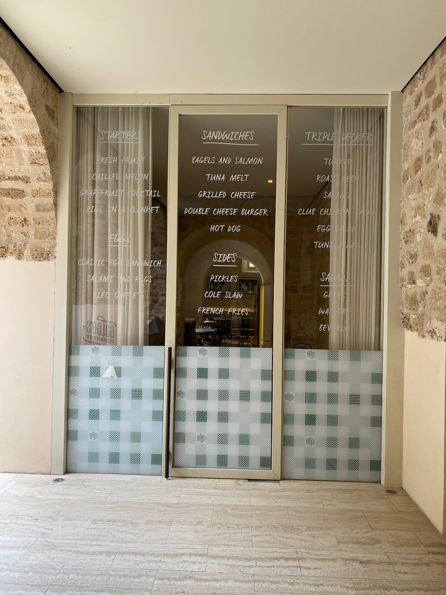 a glass doors with writing on them