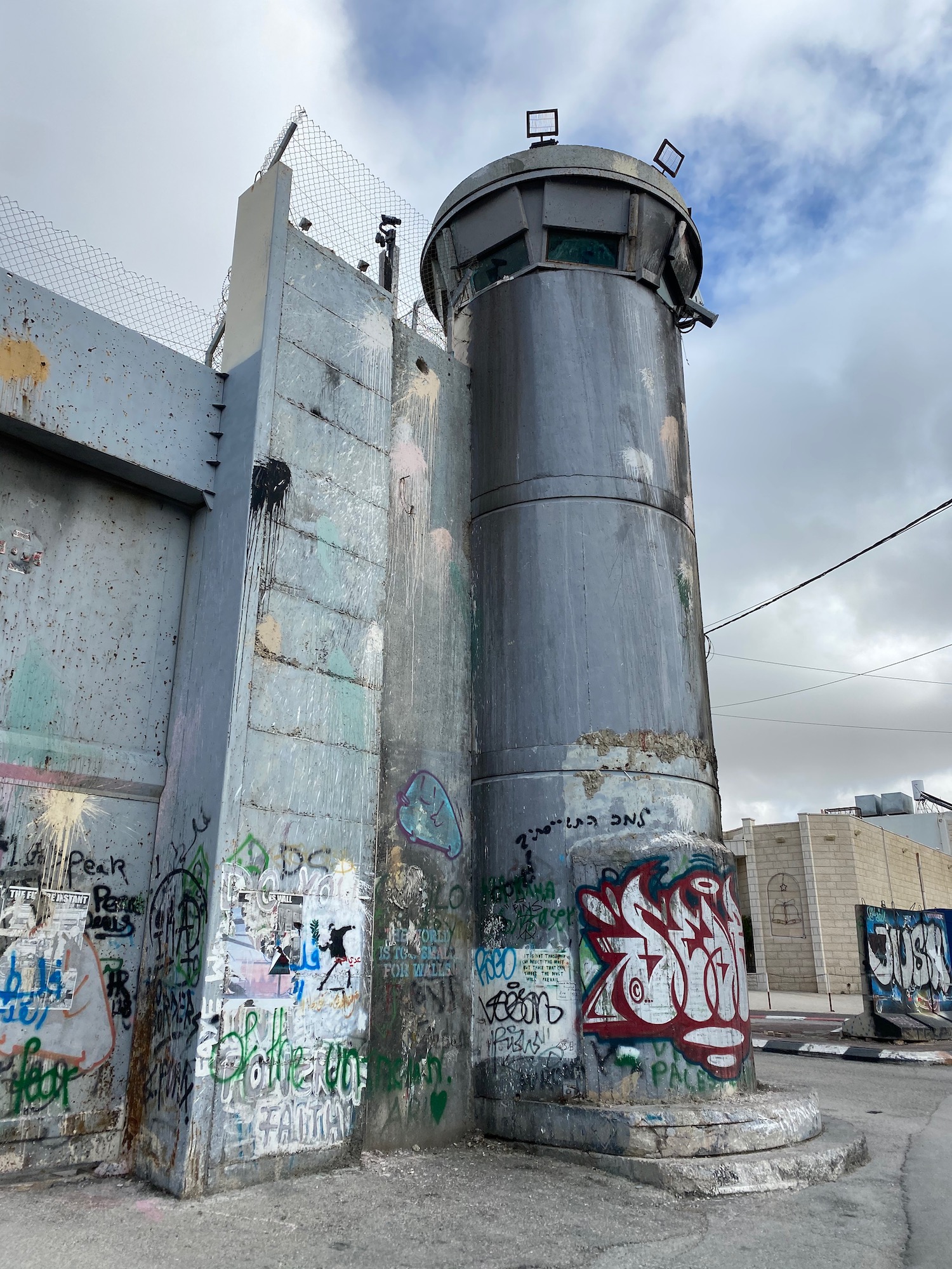 a concrete structure with graffiti on it