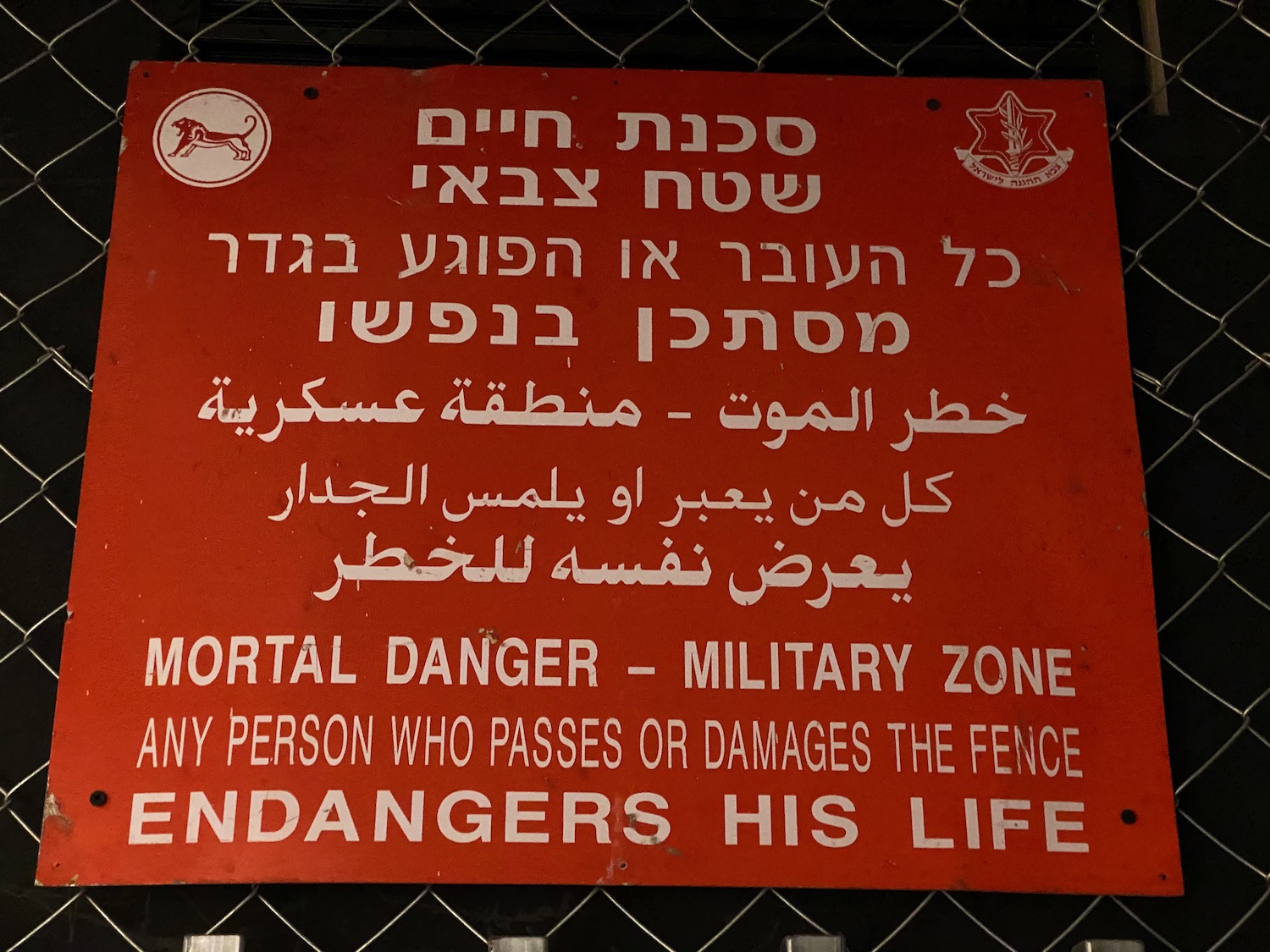 a red sign with white text on it