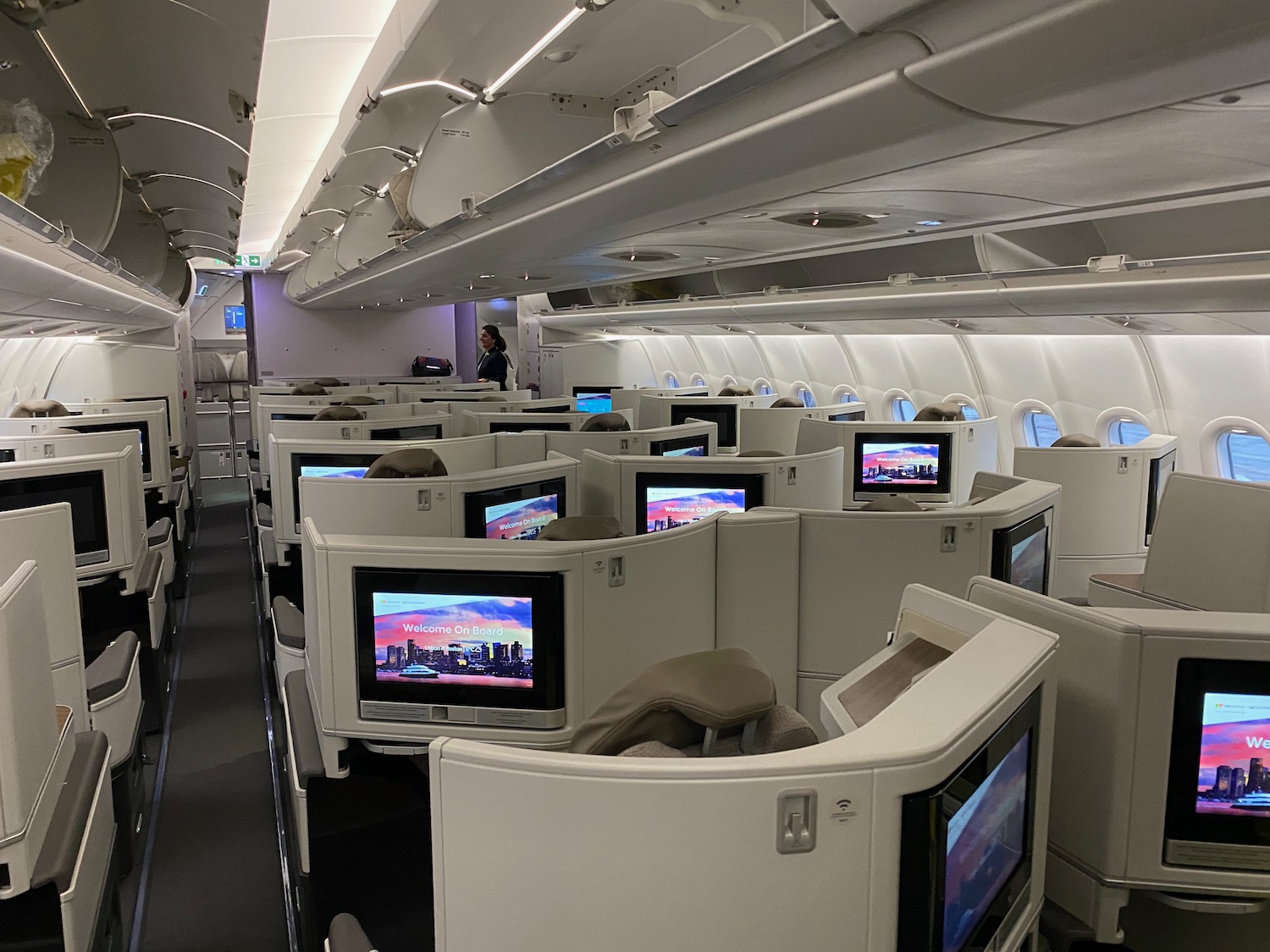 a row of monitors on an airplane
