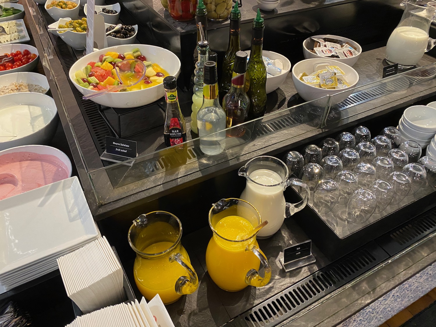 a buffet table with different drinks and beverages