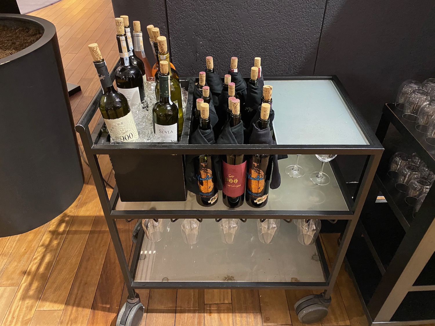 a cart with bottles of wine on it