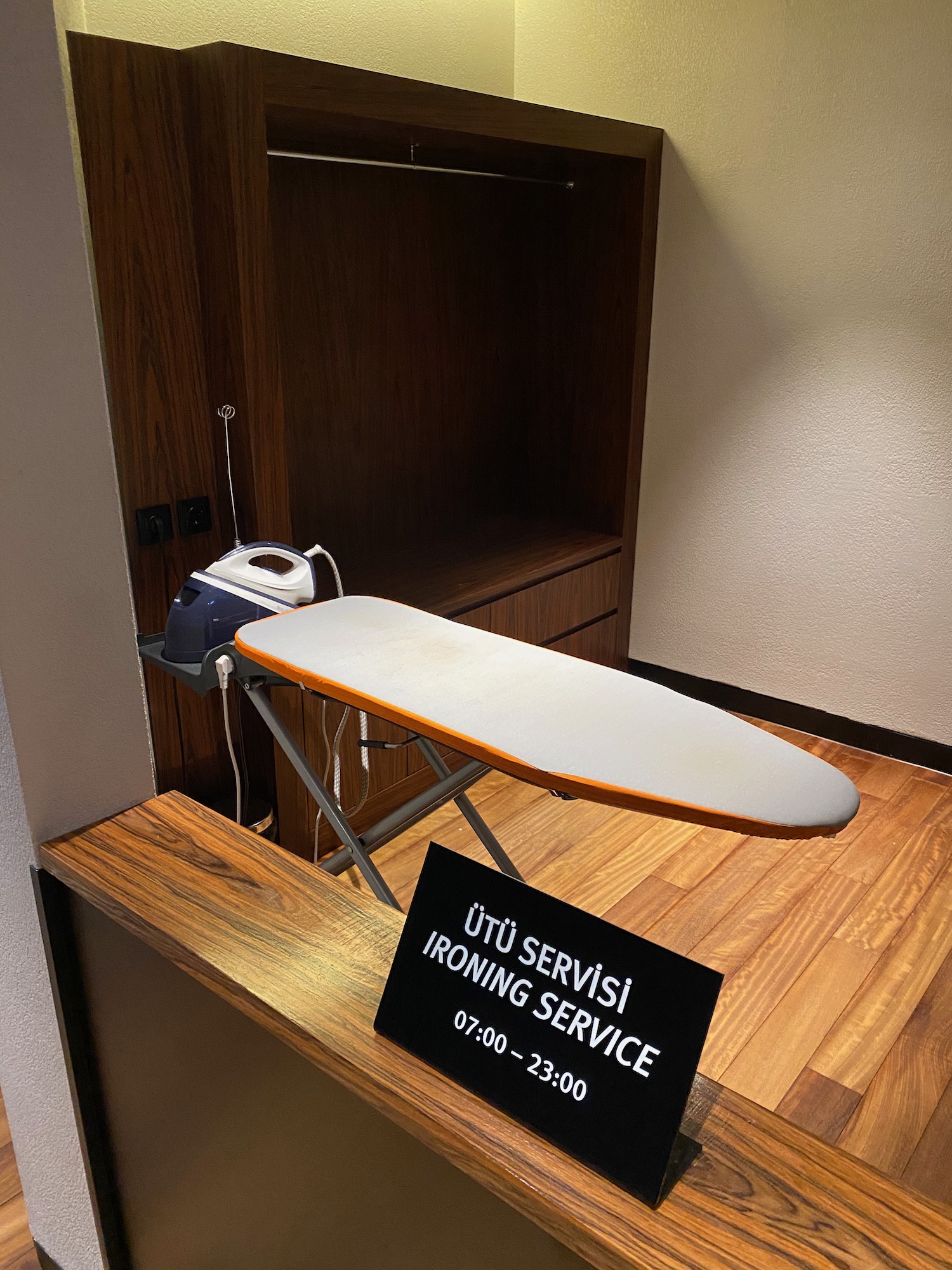 a ironing board and a sign