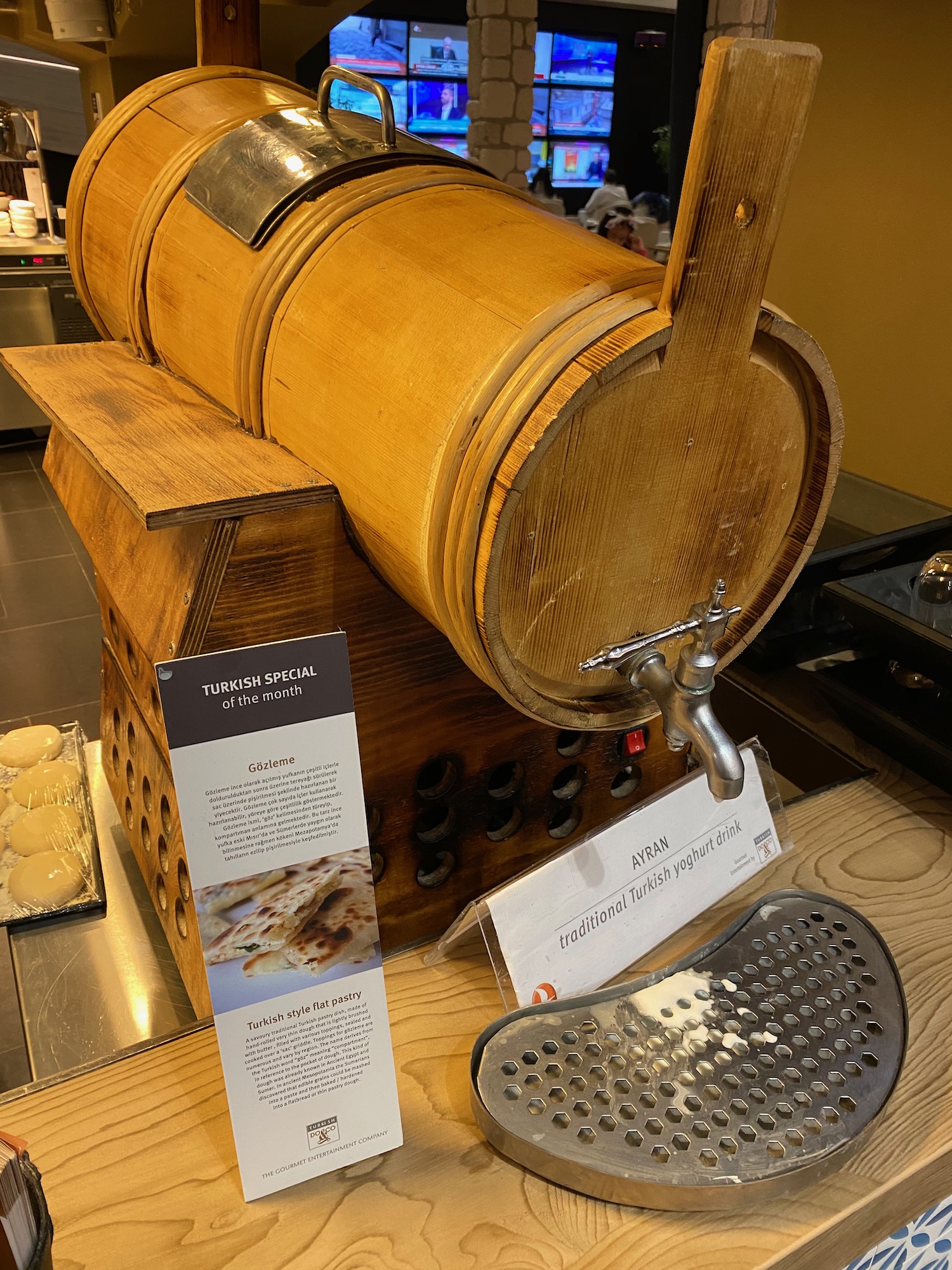 a wooden barrel with a tap on a table